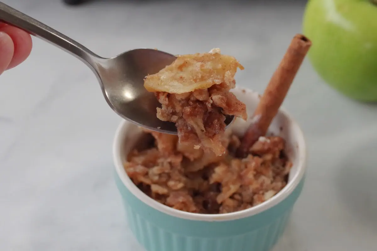 weight watchers apple crisp being held up on a spoon
