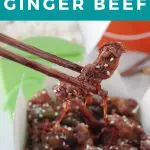 Pinterest Pin with white text on turquoise background with photo of Calgary ginger beef being held up by chopsticks