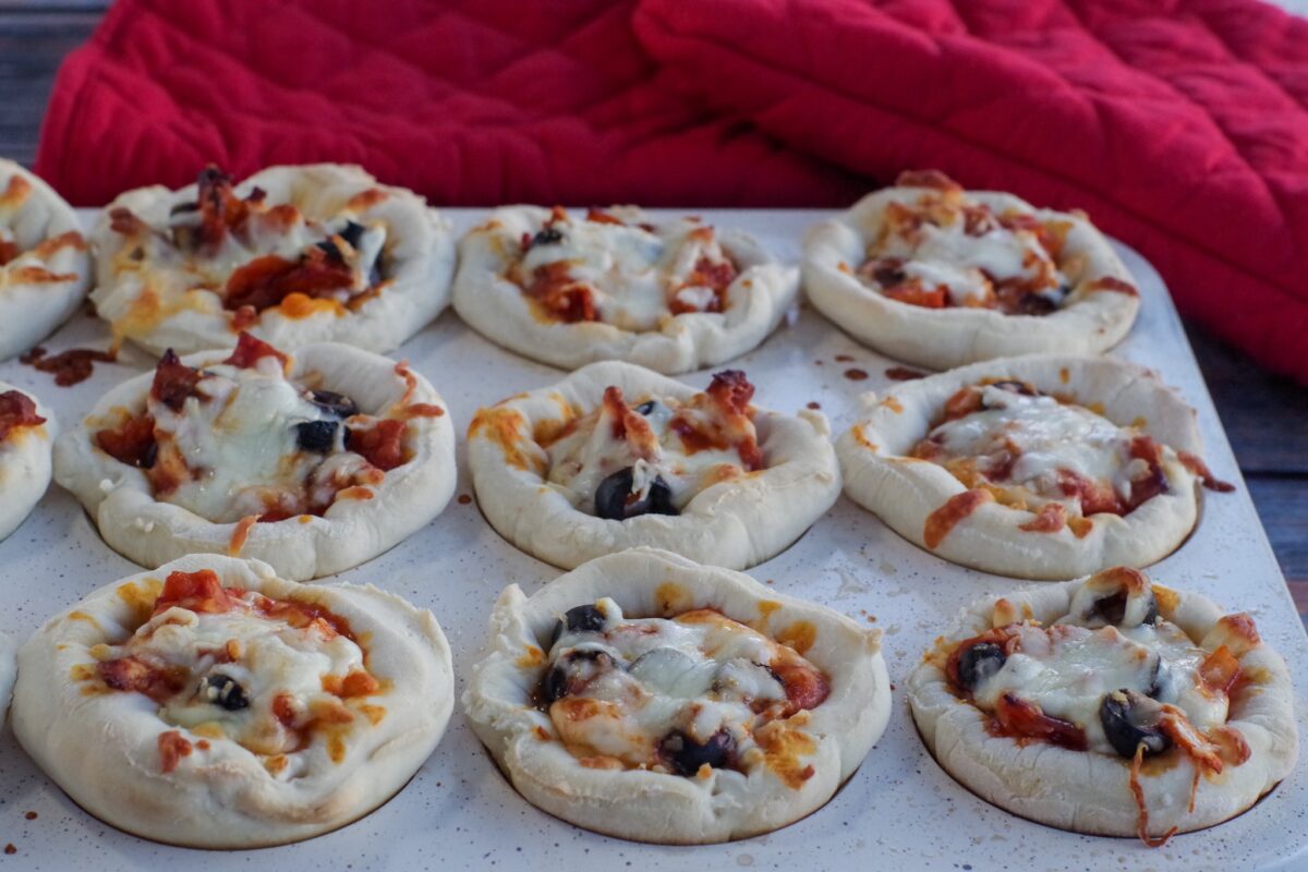 cooked pizza cupakes in a muffin tin