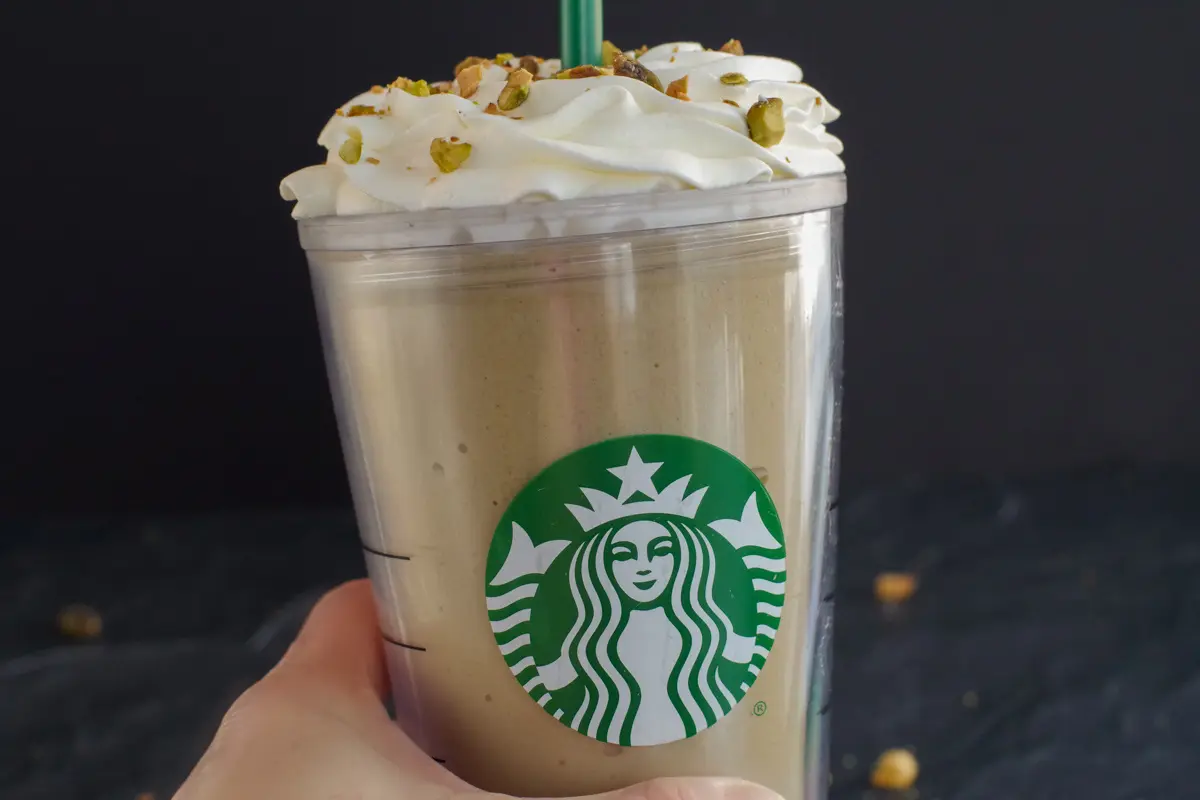 Starbucks Copycat Pistachio Frappuccino being held up by a hand