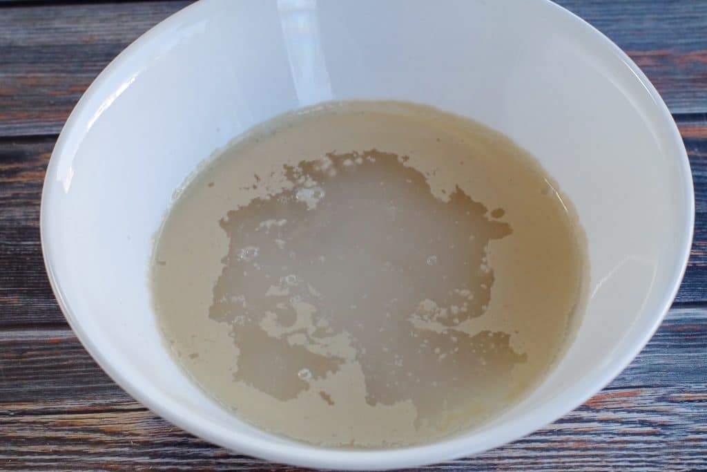 yeast and sugar dissolving in bowl