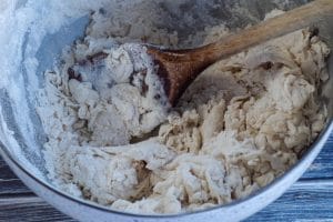 flour mixed with oil and yeast in bowl
