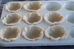 circles pressed into muffin tin
