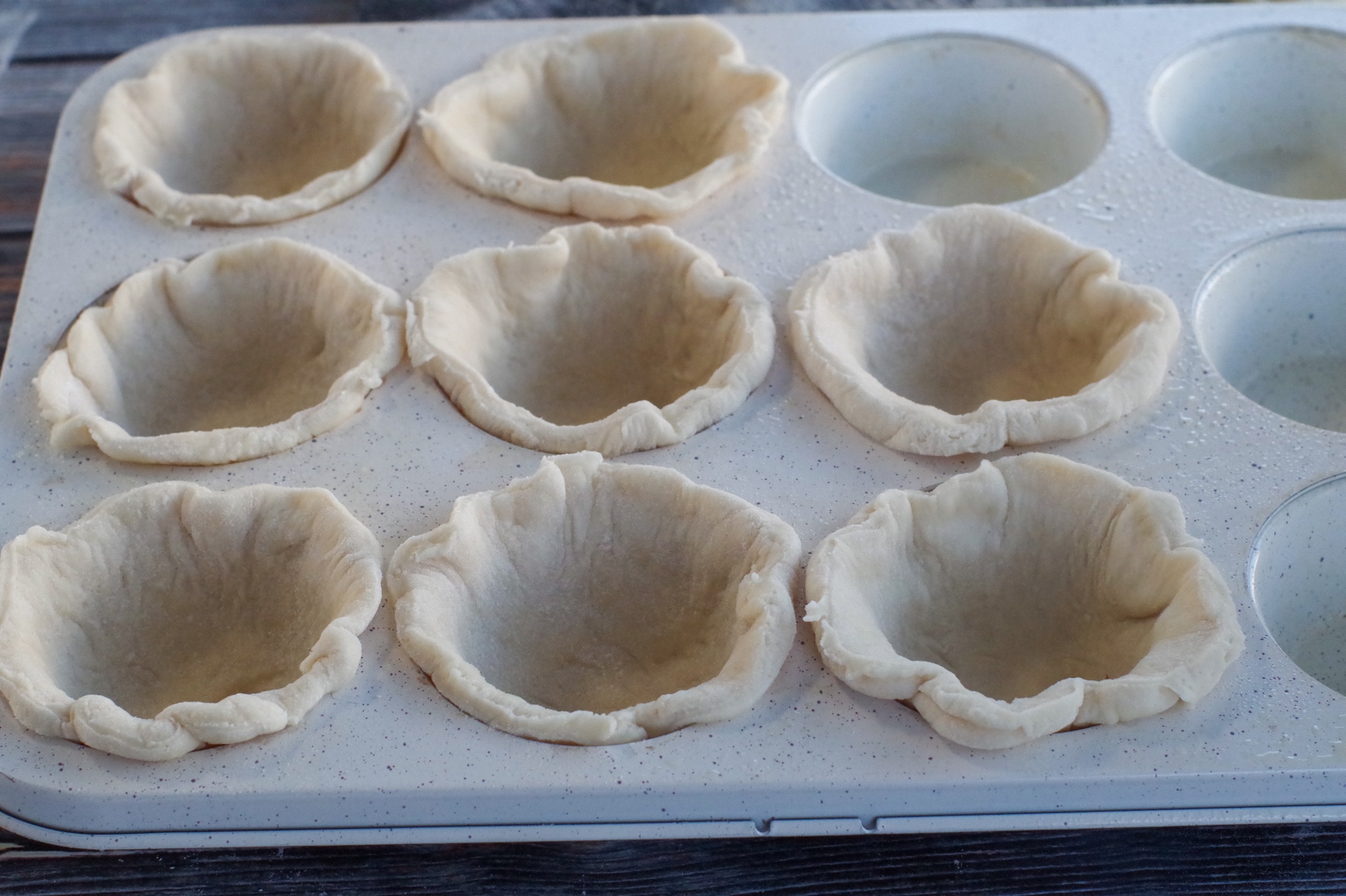 circles pressed into muffin tin