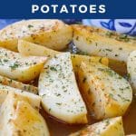 Pinterest pin with white text on blue background and photo of Greek style potatoes in a glass dish