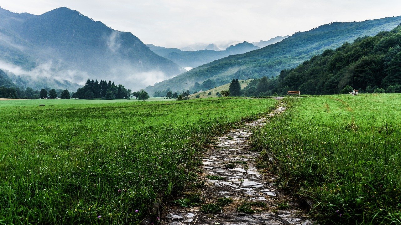 stone path with mountains in the background