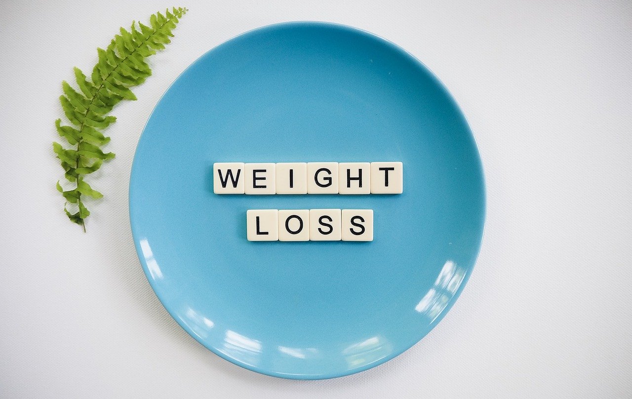 weight loss spelled out in tiles on a plate