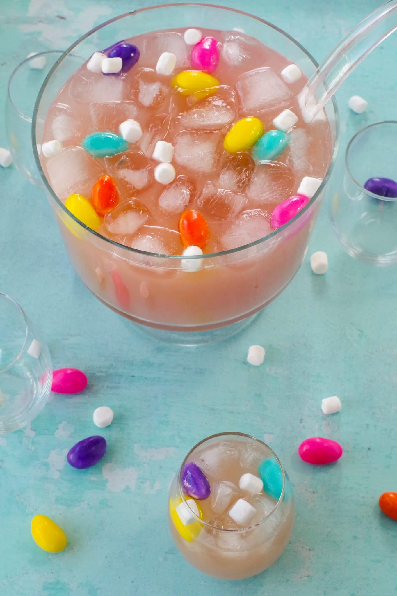 Easter punch in a trifle bowl with glass full of Easter punch, as well as marshmallow Easter eggs and mini marshmallows