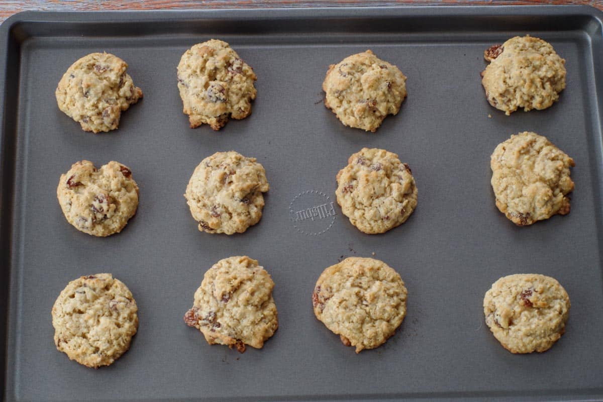 baked oatmeal raisin cookies on a cookie sheet