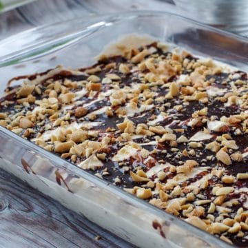 Drumstick Dessert in a glass pan on a wooden surface