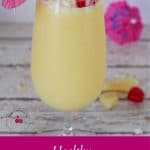pinterest pin with white text on pink background on bottom and photo of a healthy pina colada mocktail
