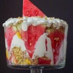 pinterest pin with white text on pink background on top and bottom and photo of watermelon trifle