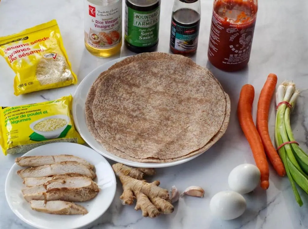 ingredients for ramen wrap on marble counter surface