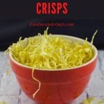 pinterest pin with orange text on black background on top and photo of parsnip crisps in an orange bowl