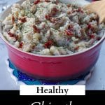 pinterest pin with text bottom and photo ofhealthy mashed potatoes in a red bowl with salt and pepper in background