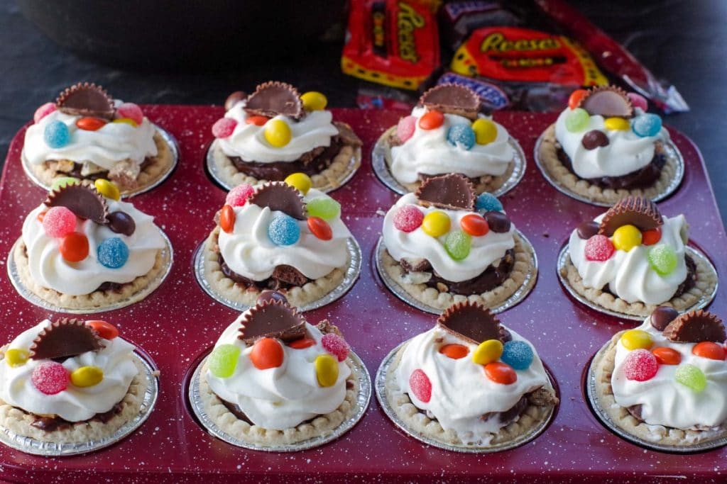leftover Halloween candy tarts in a red muffin tin