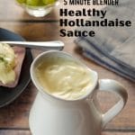 pin with black text over photo of healthy hollandaise sauce on wooden surface with eggs benedict, a bowl of green grapes and a grey napkin in the background
