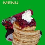 pin with green background and photo of gingerbread pancakes with cranberry compote