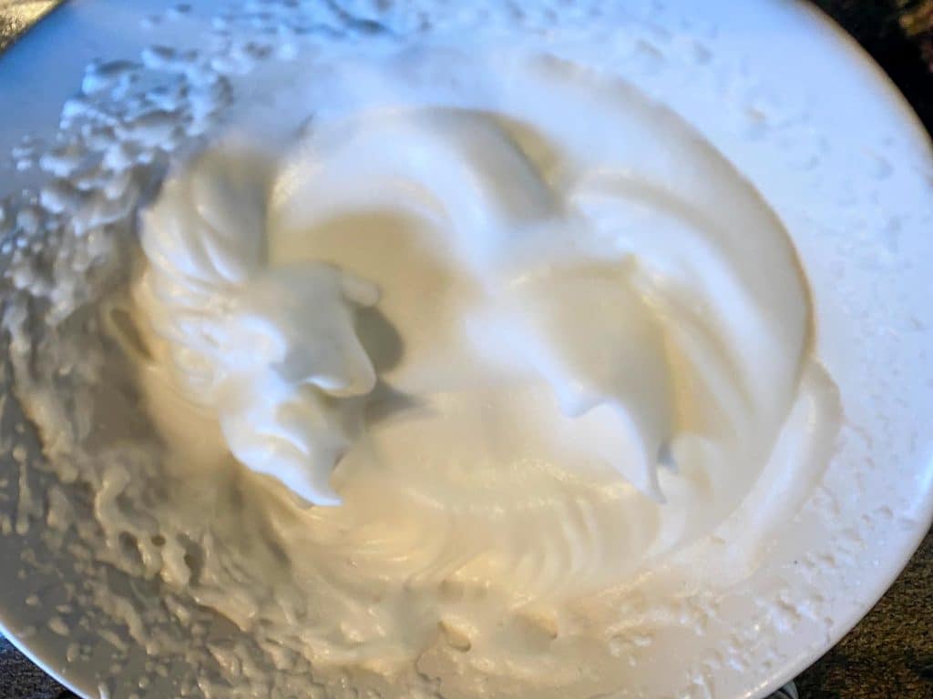 egg whites beaten to stiff in a bowl