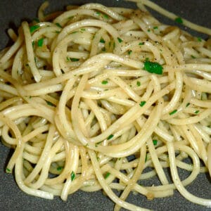 garlic olive oil pasta on a grey plate