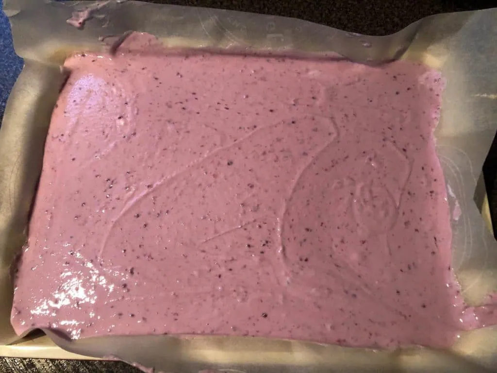 raspberry yogurt on a parchment covered baking sheet