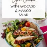 pin with photo of Cajun chicken with avocado and mango salad and black text on white background