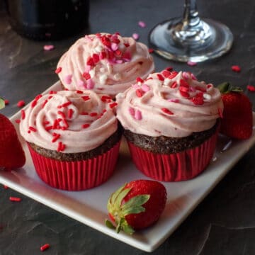 3 red wine cupcakes on a white plate