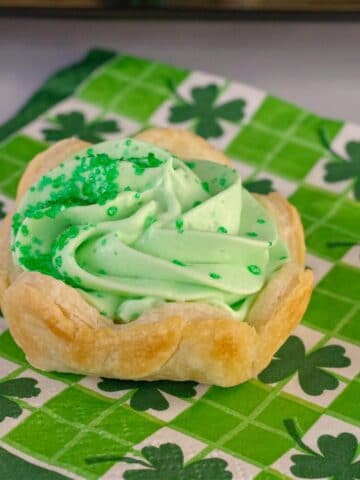 St. Patrick's Day dessert Shamrock Tart on a green shamrock patterned napkin