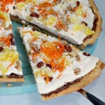 carrot cake dessert pizza slice being removed from pizza
