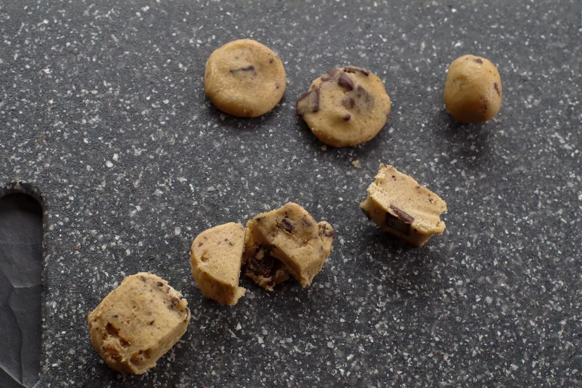 edible cookie dough shaped into cookies and chopped