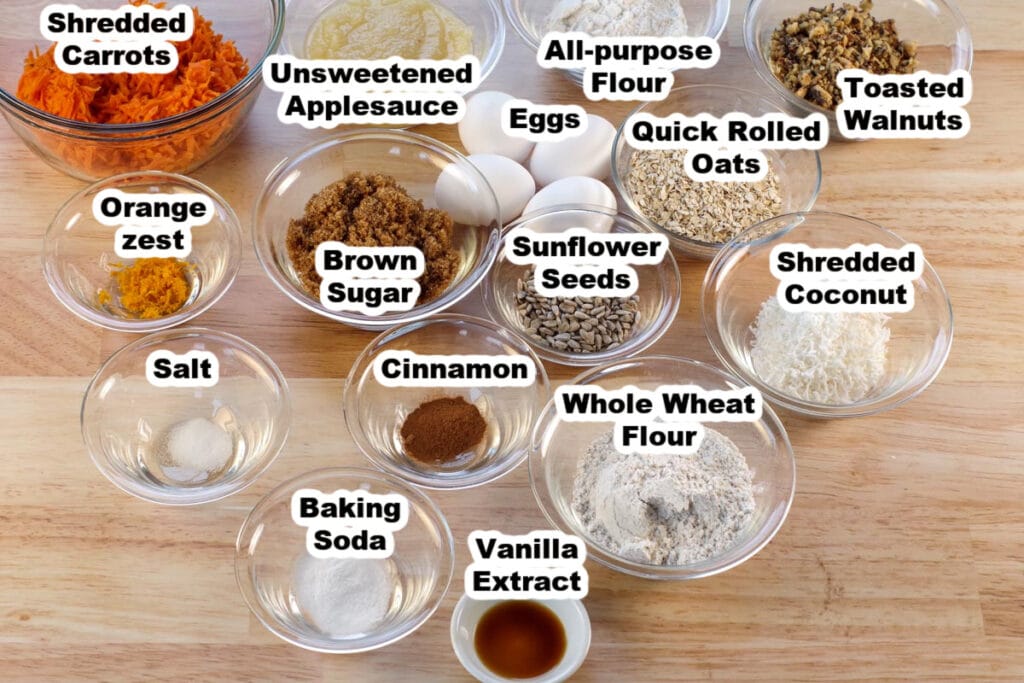 ingredients for morning glory muffins in glass bowls and labelled