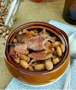 southern style ham and beans in a brown bowl