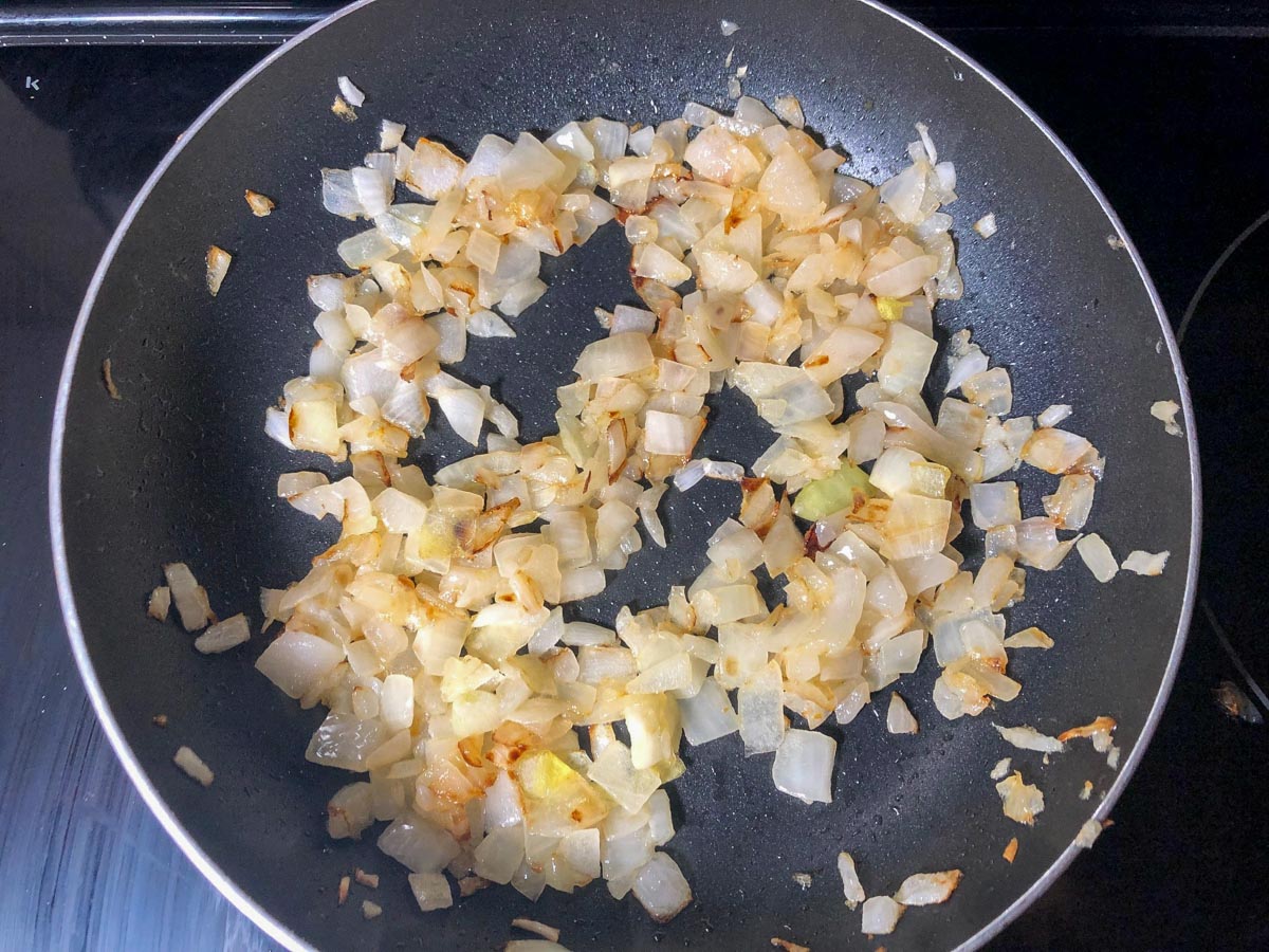 onions cooking in frying pan