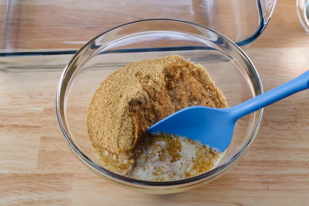 butter mixed with graham cracker crumbs