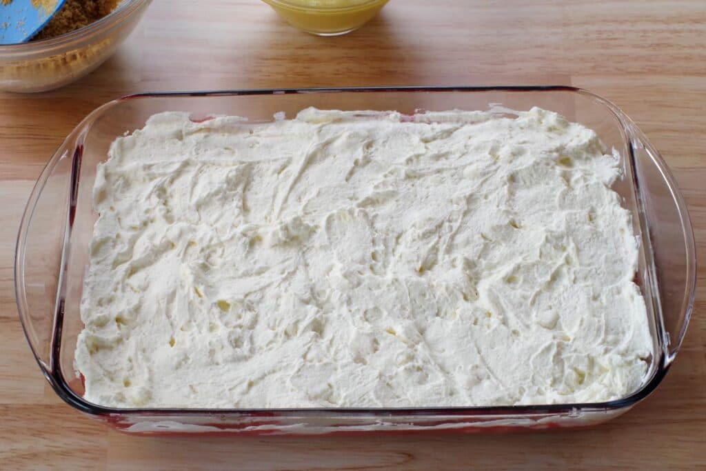 whipped cream and marshmallow mixture spread over rhubarb