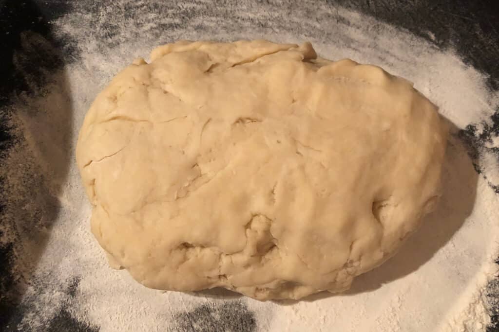 pie crust dough on floured cutting board