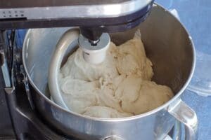 dough being kneaded in stand mixer with a hook