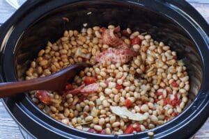 Slow cooker baked beans ingredients mixed together in the crockpot