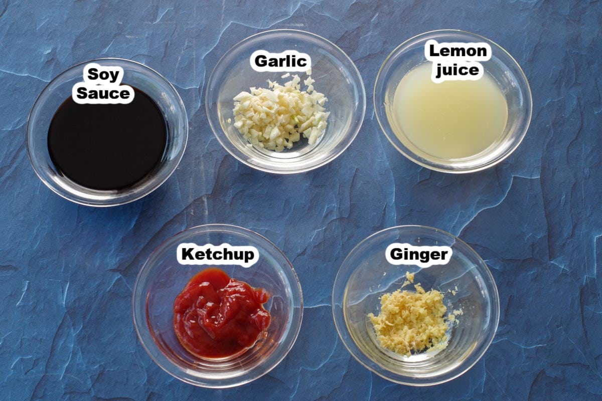 ingredients in soy ginger marinade, in glass bowls and labelled