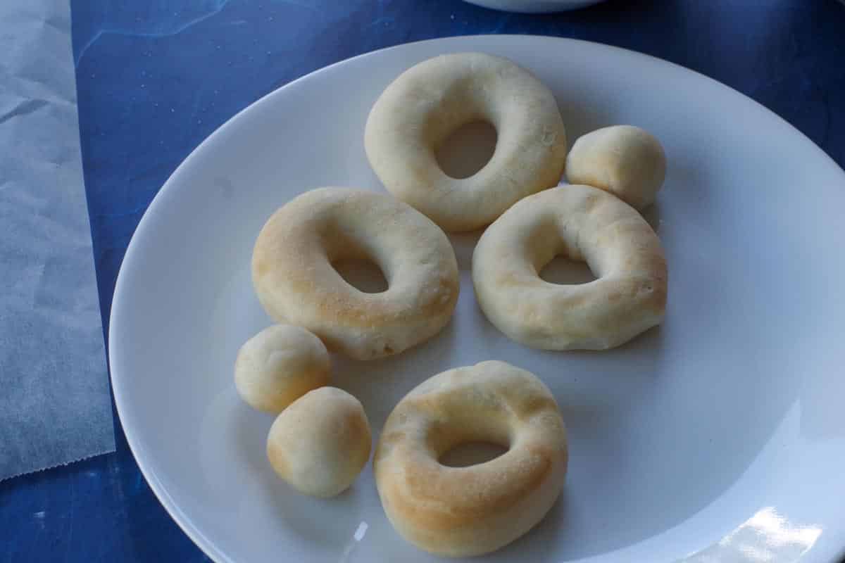 cooked (air-fried) donuts and donut holes on white plate