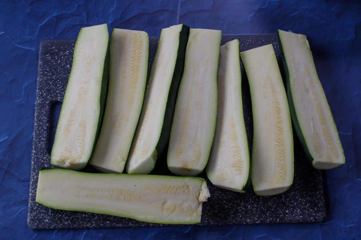 zucchini washed and cut on a cutting board