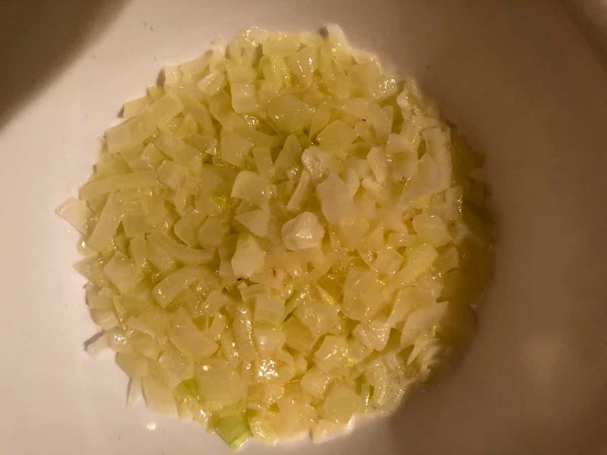 onions cooked in butter in white bowl