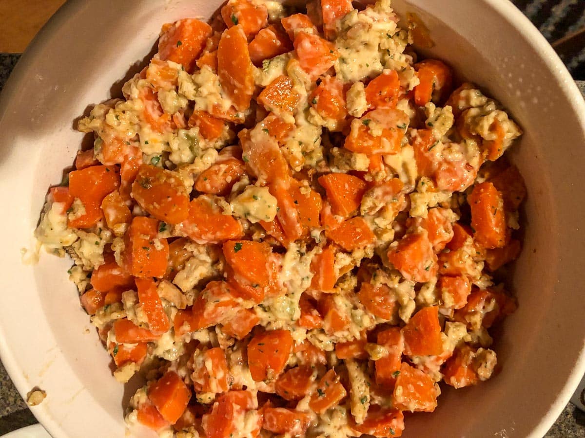 stuffing mixed with carrots and other ingredients in small casserole dish