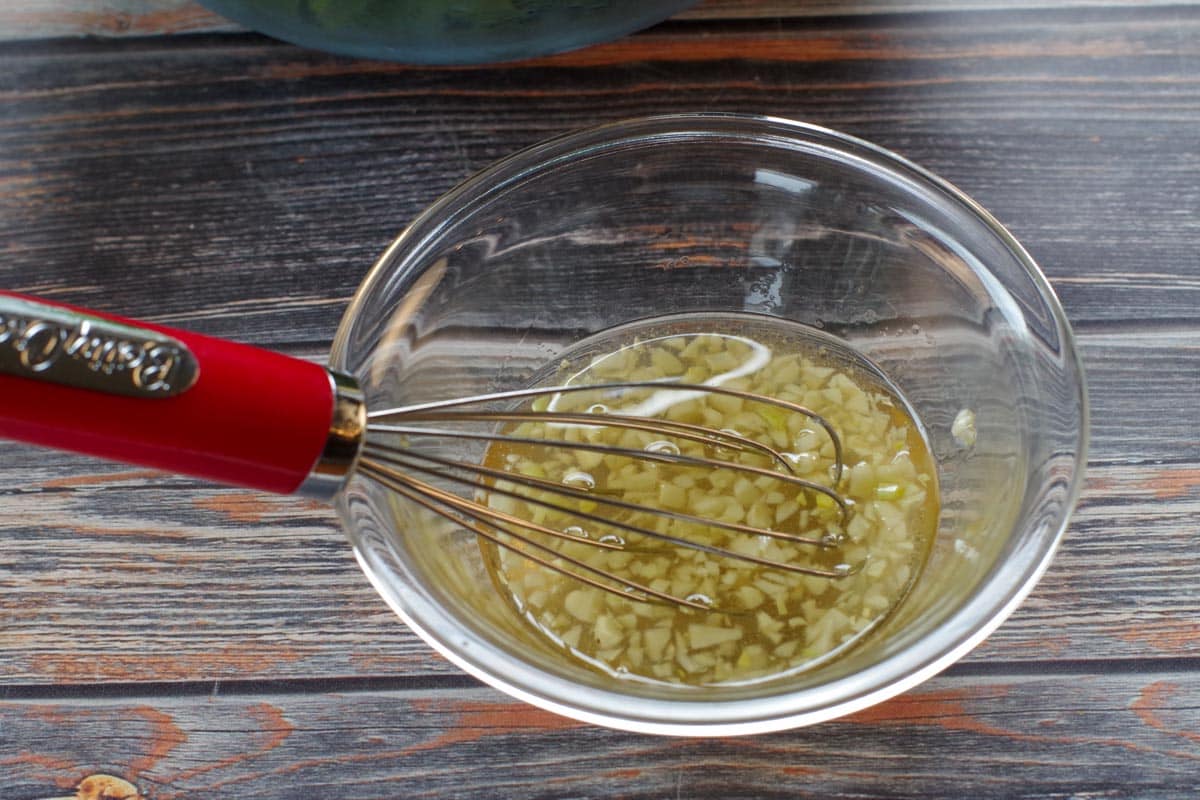 salad ingredients whisked together in a small bowl