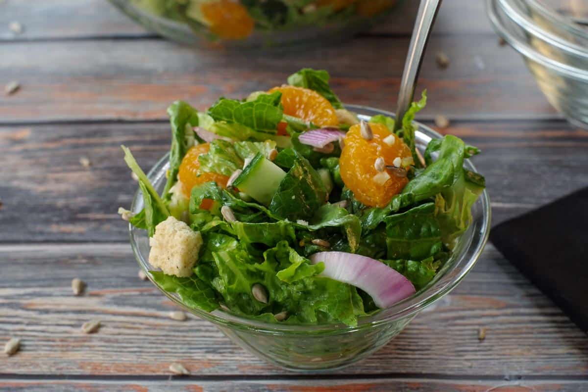 Mandarin Orange salad in a small glass bowl with a fork