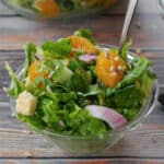 Mandarin Orange salad in a small glass bowl with a fork