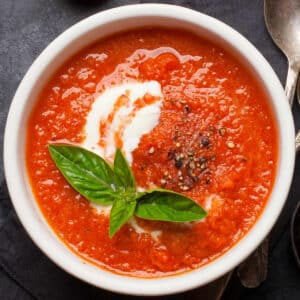 tomato basil soup in white bowl