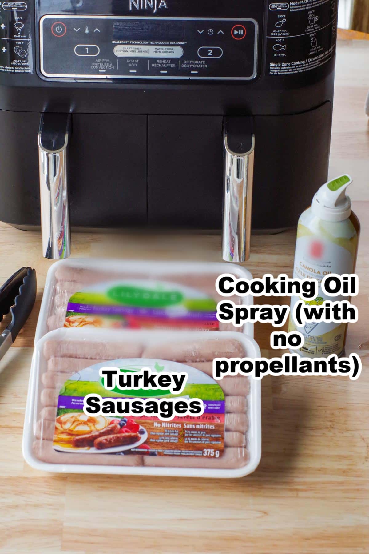 2 packages of turkey sausages and spray oil in front of an air fryer