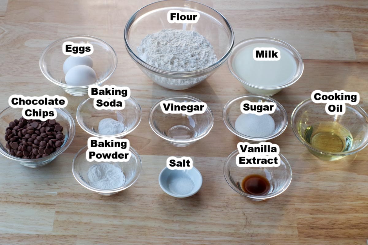 ingredients for chocolate chip pancakes in glass bowls, labelled