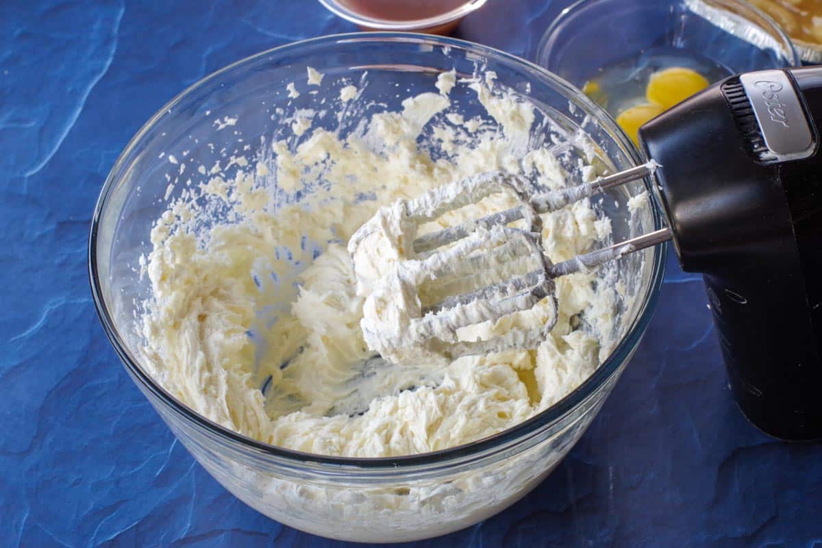cream cheese, sugar and vanilla in large glass bowl with hand mixer